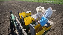 A worker prepares soybeans for planting at a farm in Tiffin, Iowa, on May 6.