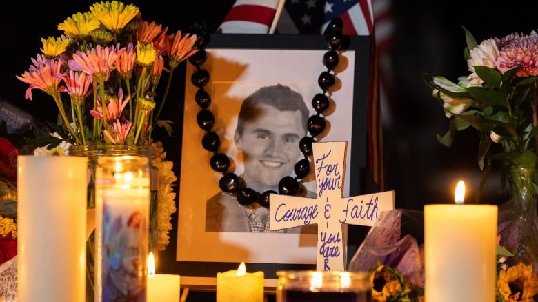 Candles and flowers are seen near a portrait of right-wing activist Charlie Kirk at a makeshift memorial during a candlelight vigil at Memorial Park in Provo, Utah, on September 12, 2025, after he was shot during a public event at Utah Valley University. The widow of prominent right-wing activist Charlie Kirk pledged on September 12 to carry on her husband's work, after US authorities announced his alleged assassin had finally been captured. The 31-year-old Kirk was hit by a single bullet while addressing a large crowd at Utah Valley University in the town of Orem on September 10.