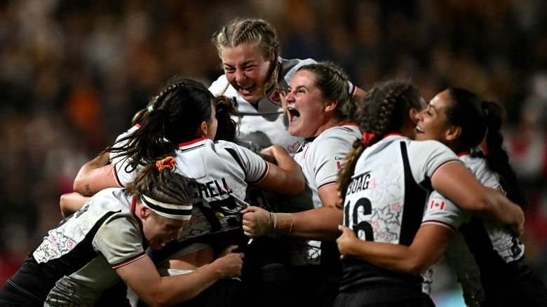 The Canadian players celebrate their famous victory over New Zealand.