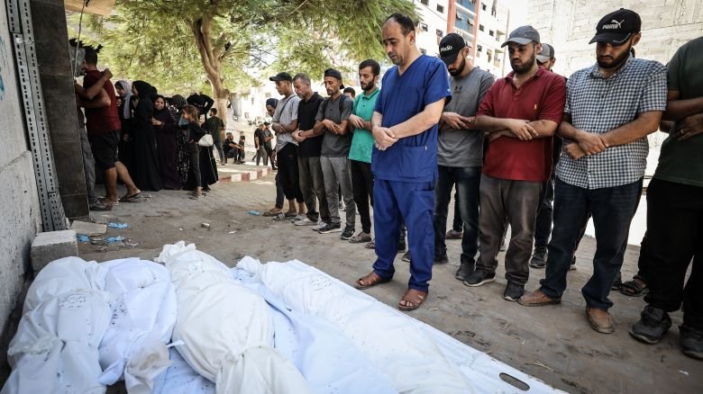 Citizens and relatives of the Palestinians, including children, who died as a result of Israeli army attack on Abu Salmiya family apartment in Al-Shati refugee camp perform funeral prayer after bodies were taken from al-Shifa Hospital for burial in Gaza City, Gaza on September 20, 2025.