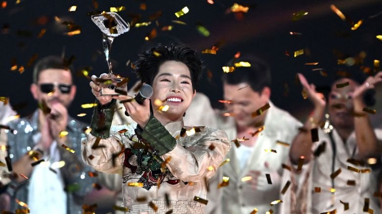 Vietnam's Duc Phuc lifts the trophy as he celebrates winning the "Intervision" song contest in Moscow on Sunday.