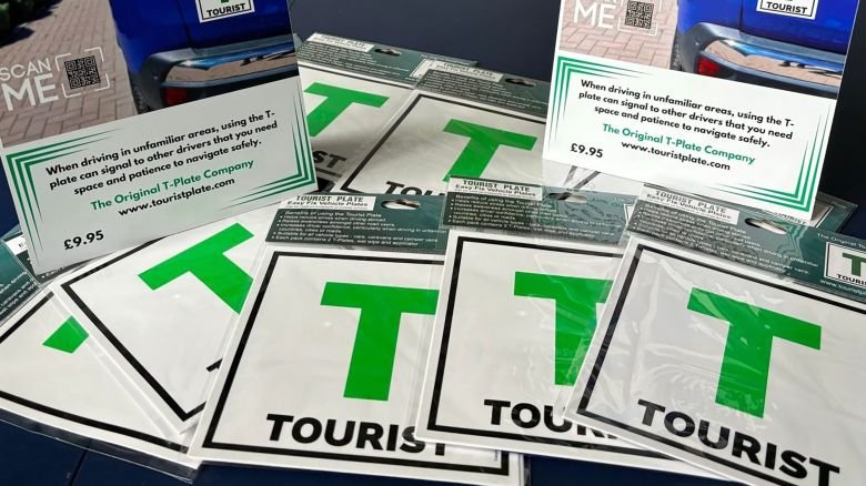 Tourist car stickers are seen for sale.
